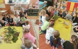 Dzieci oglądają materiały potrzebne do wykonania pracy
